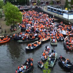 Amsterdam king formerly report orange queen gathered crowds huge party city over